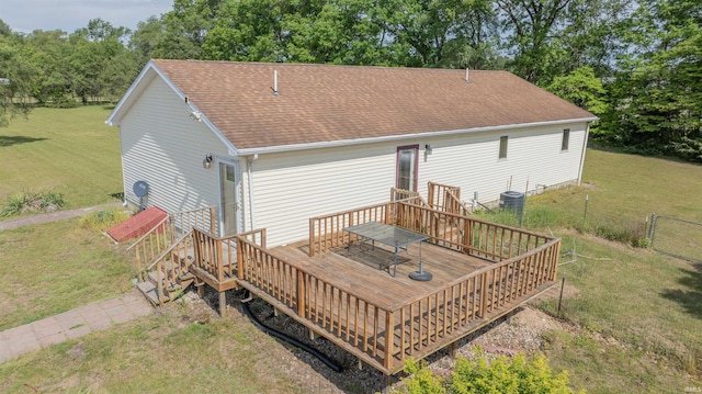 7768 S 100 W, North Judson, IN 46366 - back of property featuring a deck, a shingled roof, and view of scattered trees