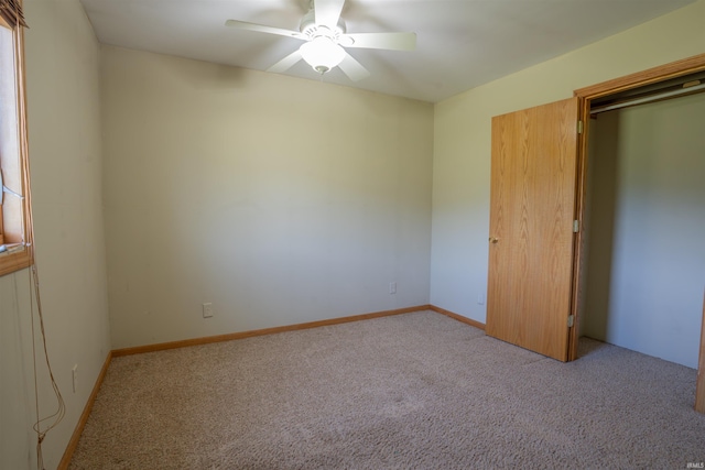 7768 S 100 W, North Judson, IN 46366 - unfurnished bedroom featuring carpet flooring and a ceiling fan