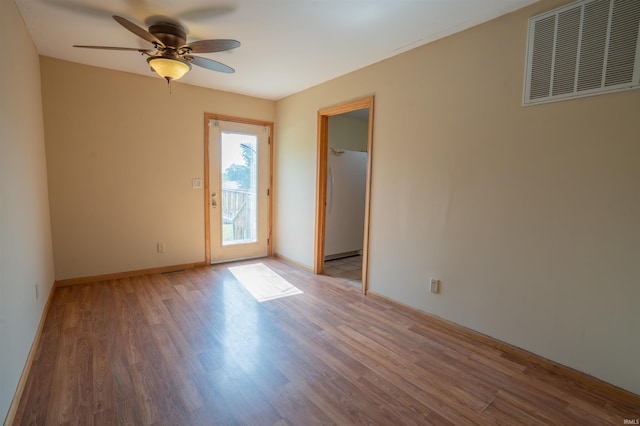 7768 S 100 W, North Judson, IN 46366 - spare room with ceiling fan, wood finished floors, and baseboards