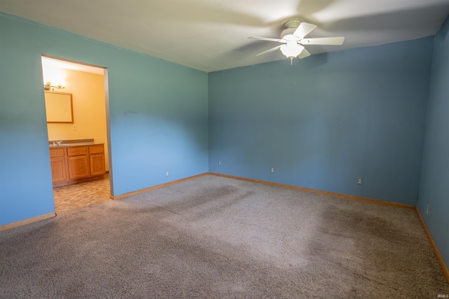 7768 S 100 W, North Judson, IN 46366 - empty room with a ceiling fan, light colored carpet, and baseboards