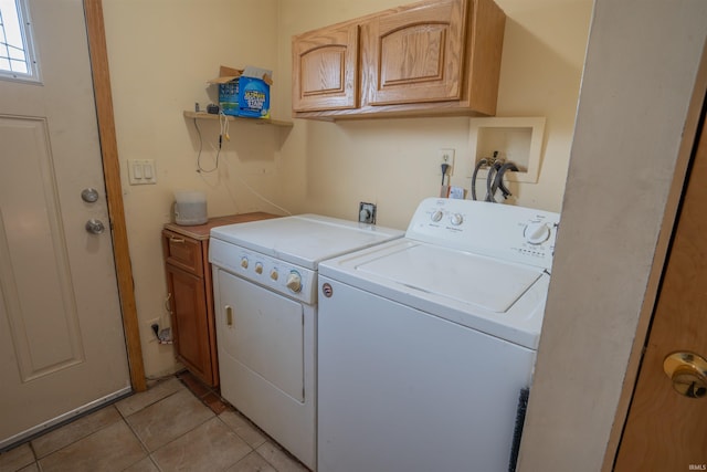 7768 S 100 W, North Judson, IN 46366 - laundry room featuring cabinet space, washer and clothes dryer, and light tile patterned floors