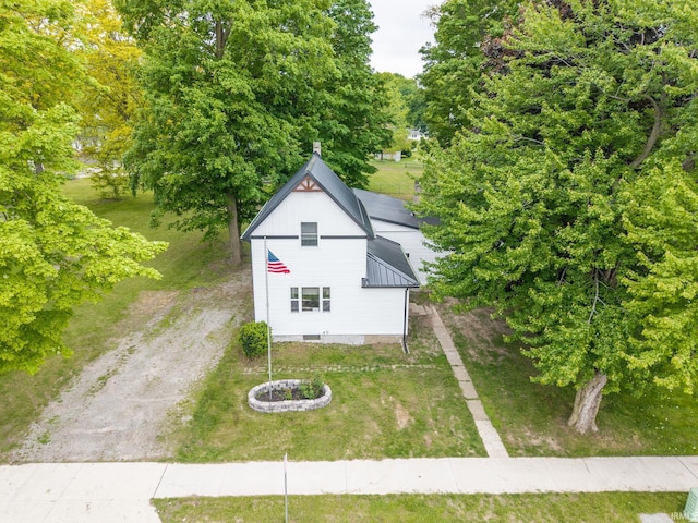 608 Union St, Lagrange, IN 46761 - view of property exterior with a yard and view of wooded area
