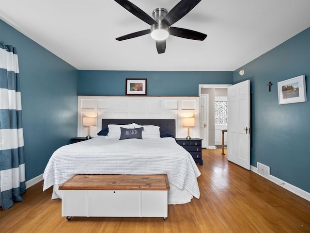 2728 E Dr, Fort Wayne, IN 46805 - bedroom with wood finished floors, baseboards, and a ceiling fan