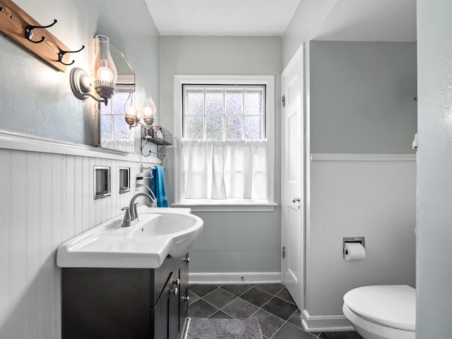 2728 E Dr, Fort Wayne, IN 46805 - half bathroom with vanity, tile patterned flooring, and toilet