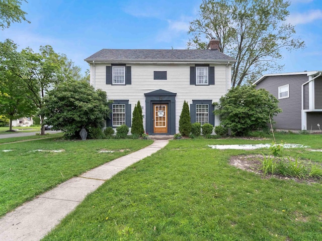 2728 E Dr, Fort Wayne, IN 46805 - colonial inspired home featuring a chimney and a front lawn