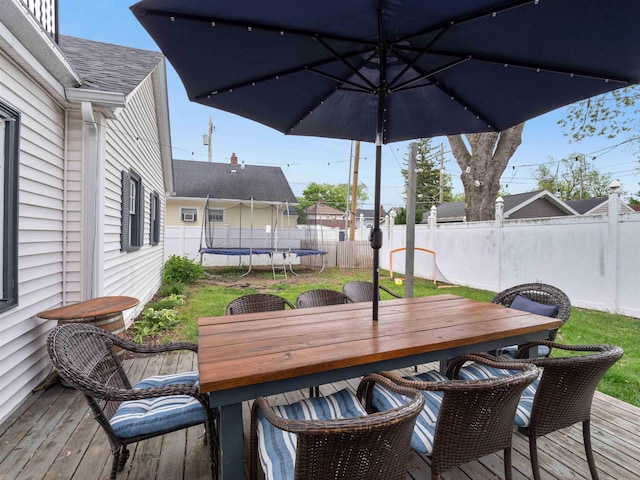 2728 E Dr, Fort Wayne, IN 46805 - wooden deck featuring a trampoline and outdoor dining area