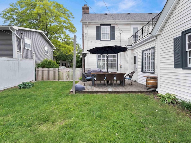 2728 E Dr, Fort Wayne, IN 46805 - back of house featuring a chimney, a wooden deck, roof with shingles, and a balcony
