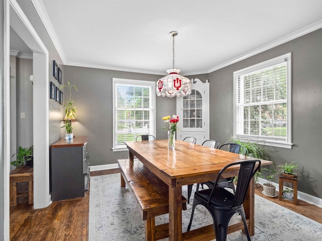 2728 E Dr, Fort Wayne, IN 46805 - dining area featuring wood finished floors, crown molding, and baseboards