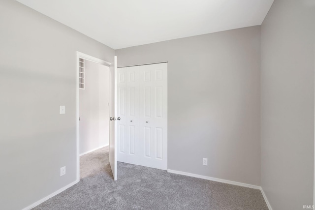 1813 Crescent Dr, Warsaw, IN 46580 - unfurnished bedroom with carpet flooring, a closet, and baseboards