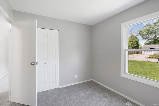 1813 Crescent Dr, Warsaw, IN 46580 - unfurnished bedroom with carpet, baseboards, and a closet