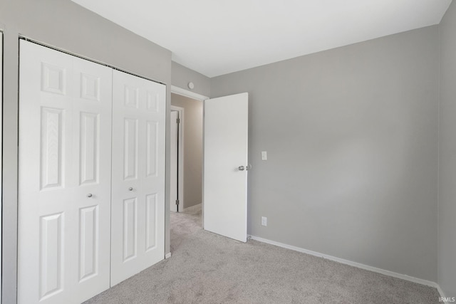 1813 Crescent Dr, Warsaw, IN 46580 - unfurnished bedroom featuring light colored carpet, a closet, and baseboards