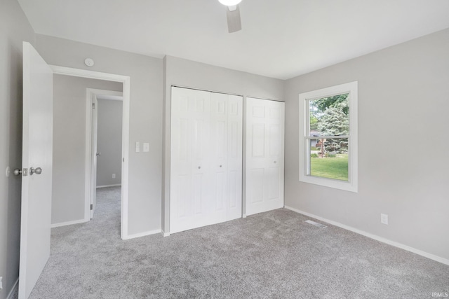 1813 Crescent Dr, Warsaw, IN 46580 - unfurnished bedroom with carpet flooring, baseboards, and multiple closets