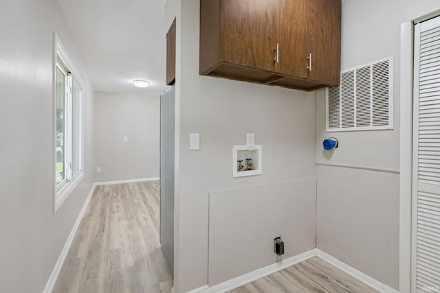 1813 Crescent Dr, Warsaw, IN 46580 - laundry room featuring cabinet space, hookup for a washing machine, light wood-type flooring, and baseboards