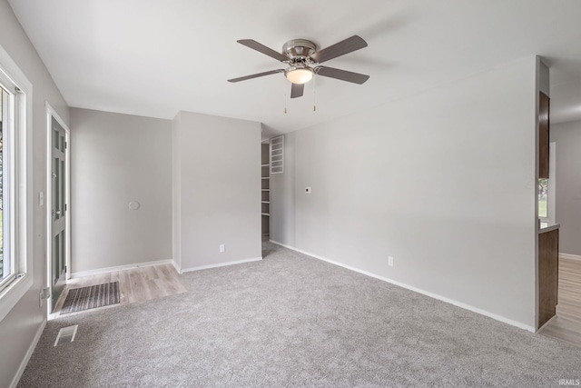 1813 Crescent Dr, Warsaw, IN 46580 - unfurnished bedroom featuring carpet flooring, baseboards, and ceiling fan