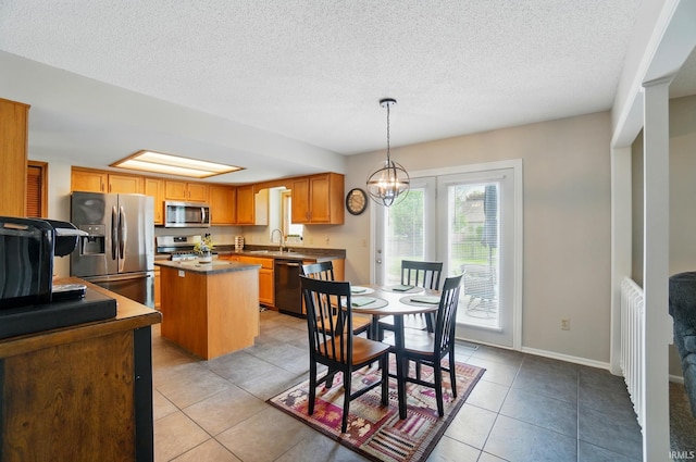 8427 Victoria Woods Pl, Fort Wayne, IN 46825 - dining space with a textured ceiling, light tile patterned floors, a chandelier, and baseboards