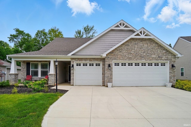 7756 Haven Blvd, Fort Wayne, IN 46804 - craftsman-style home featuring a garage, stone siding, concrete driveway, and a front yard