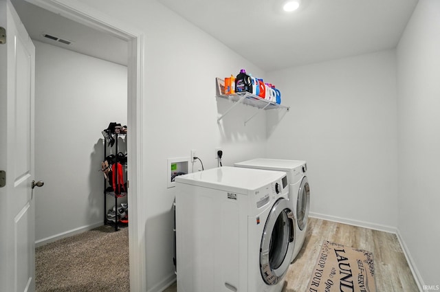 7756 Haven Blvd, Fort Wayne, IN 46804 - laundry area featuring washing machine and clothes dryer, light wood-style flooring, and baseboards