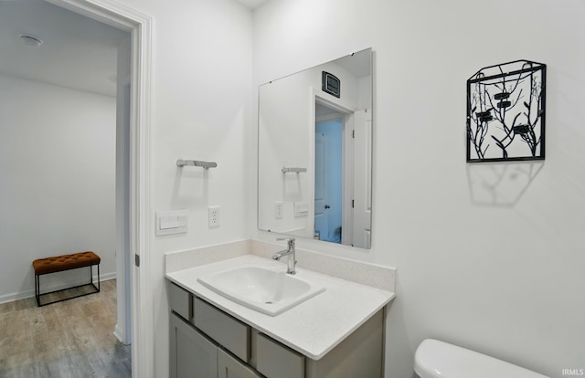 7756 Haven Blvd, Fort Wayne, IN 46804 - half bath featuring vanity, toilet, and wood finished floors