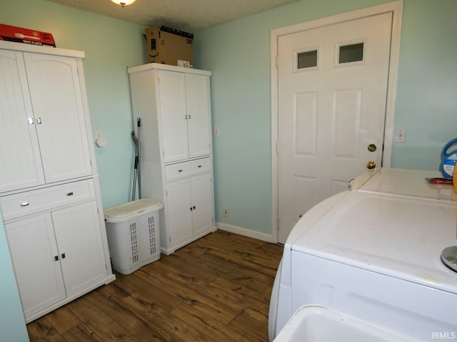105 Shawnee Dr, Bedford, IN 47421 - laundry room featuring washing machine and clothes dryer, dark wood-type flooring, cabinet space, and baseboards