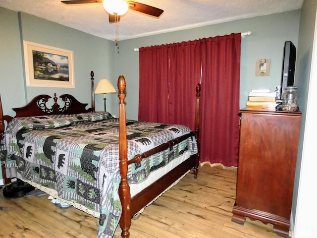 105 Shawnee Dr, Bedford, IN 47421 - bedroom with wood finished floors and a ceiling fan