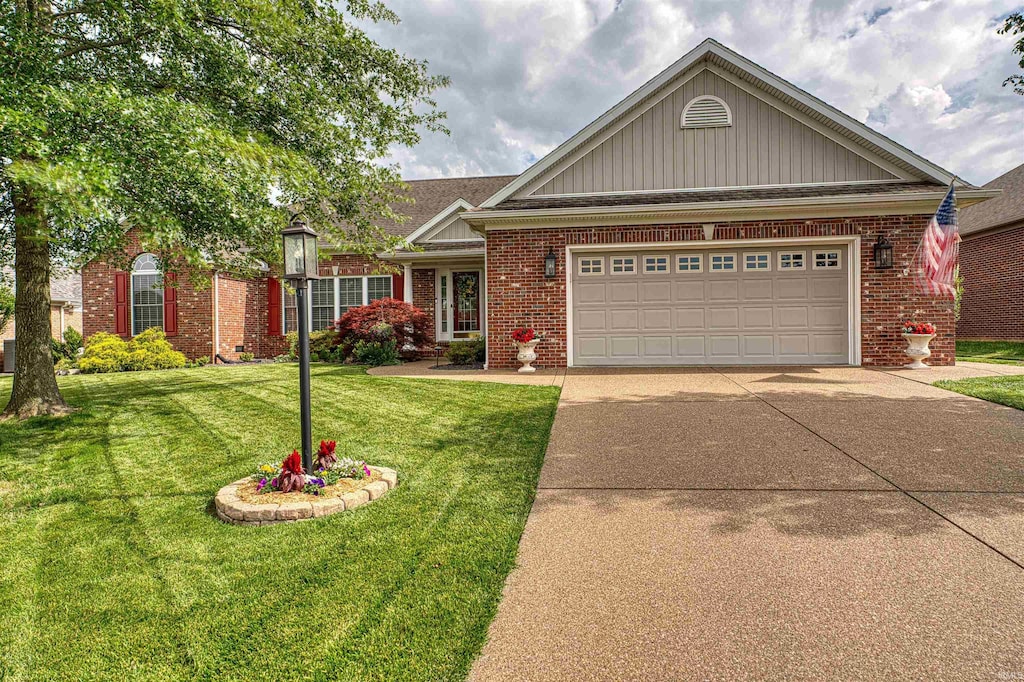 2923 Bailey Ln, Evansville, IN 47725 - view of front of house featuring brick siding, concrete driveway, a front lawn, a garage, and board and batten siding