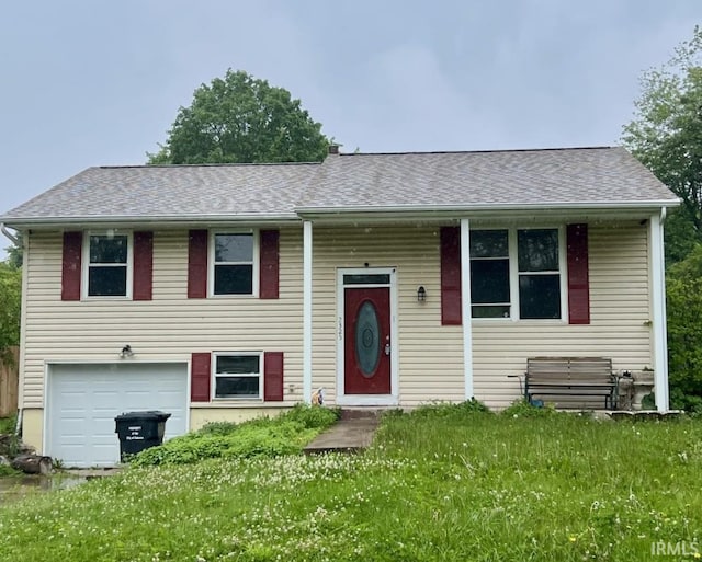 2325 Balmoral Blvd, Kokomo, IN 46902 - raised ranch with a garage, roof with shingles, and a front lawn