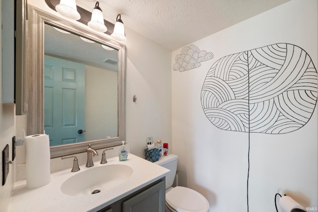 1544 Shining Armor Ln, West Lafayette, IN 47906 - bathroom with toilet, vanity, and a textured ceiling