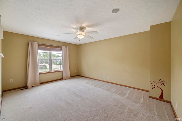 1544 Shining Armor Ln, West Lafayette, IN 47906 - spare room with carpet, a ceiling fan, and baseboards
