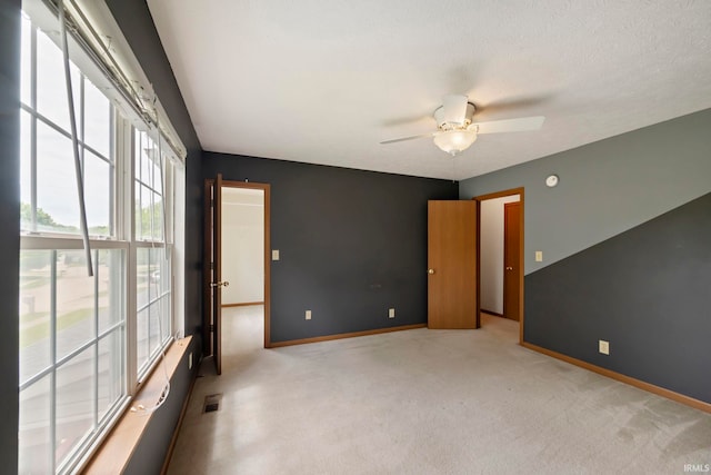 1544 Shining Armor Ln, West Lafayette, IN 47906 - empty room with light carpet, baseboards, and a ceiling fan