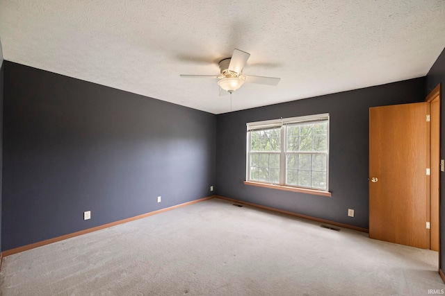 1544 Shining Armor Ln, West Lafayette, IN 47906 - empty room with carpet flooring, baseboards, a ceiling fan, and a textured ceiling