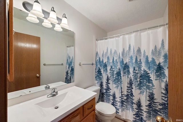 1544 Shining Armor Ln, West Lafayette, IN 47906 - full bathroom with vanity, toilet, a textured ceiling, and curtained shower