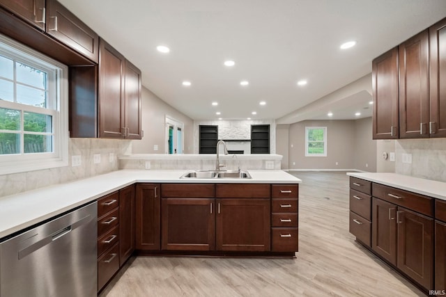 2213 Old Oak Dr, West Lafayette, IN 47906 - kitchen with dishwasher, a sink, light wood finished floors, a peninsula, and open floor plan