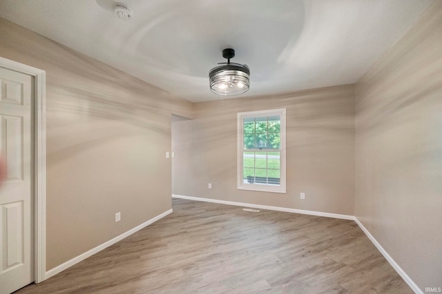 2213 Old Oak Dr, West Lafayette, IN 47906 - unfurnished room featuring a smoke detector, baseboards, wood finished floors, and a ceiling fan