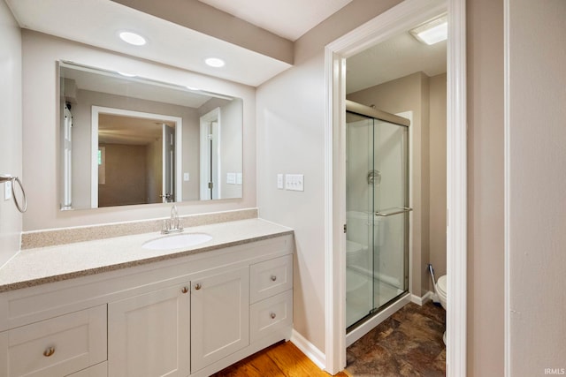 2213 Old Oak Dr, West Lafayette, IN 47906 - full bathroom featuring a shower stall, toilet, vanity, baseboards, and recessed lighting