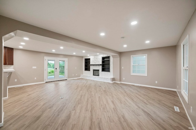2213 Old Oak Dr, West Lafayette, IN 47906 - unfurnished living room featuring light wood-type flooring, baseboards, recessed lighting, and a large fireplace
