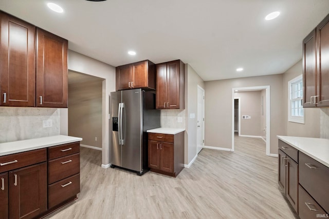 2213 Old Oak Dr, West Lafayette, IN 47906 - kitchen featuring stainless steel fridge with ice dispenser, baseboards, light wood finished floors, light countertops, and recessed lighting