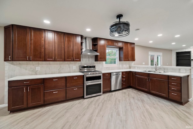 2213 Old Oak Dr, West Lafayette, IN 47906 - kitchen with wall chimney range hood, appliances with stainless steel finishes, a sink, light wood-style flooring, and recessed lighting