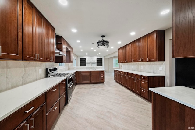 2213 Old Oak Dr, West Lafayette, IN 47906 - kitchen with double oven range, a sink, light wood-type flooring, recessed lighting, and decorative backsplash