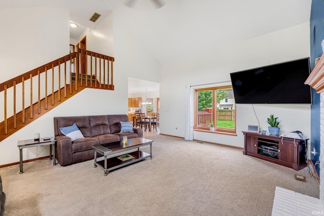 5531 Gate Tree Ln, Fort Wayne, IN 46835 - living room with carpet flooring, stairs, baseboards, and high vaulted ceiling
