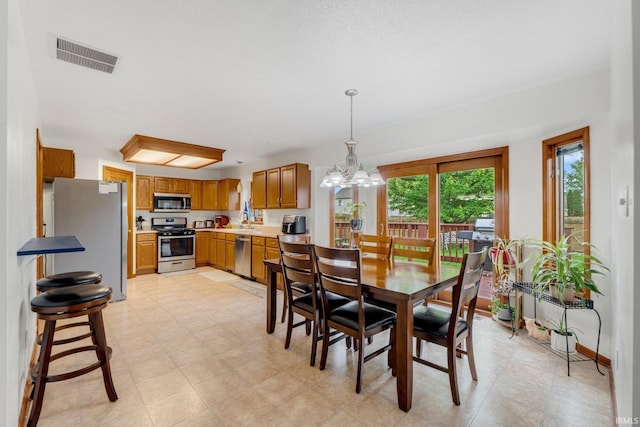 5531 Gate Tree Ln, Fort Wayne, IN 46835 - dining space with a chandelier and light floors