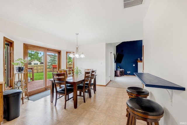 5531 Gate Tree Ln, Fort Wayne, IN 46835 - dining area featuring a chandelier, baseboards, and light carpet