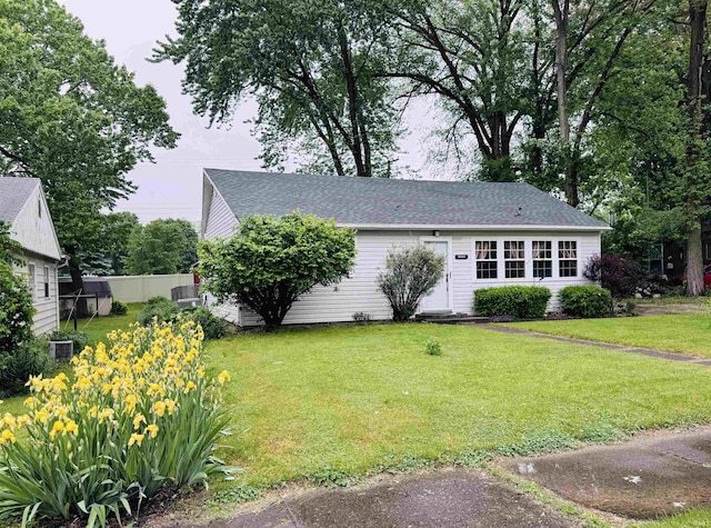 1005 Elm St, Plymouth, IN 46563 - view of front of home featuring a front lawn and a shingled roof
