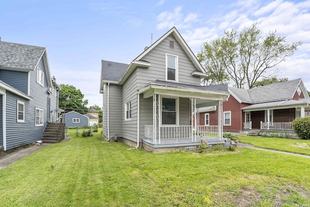 2121 Parnell Ave, Fort Wayne, IN 46805 - view of front of property featuring a porch, a front yard, and roof with shingles