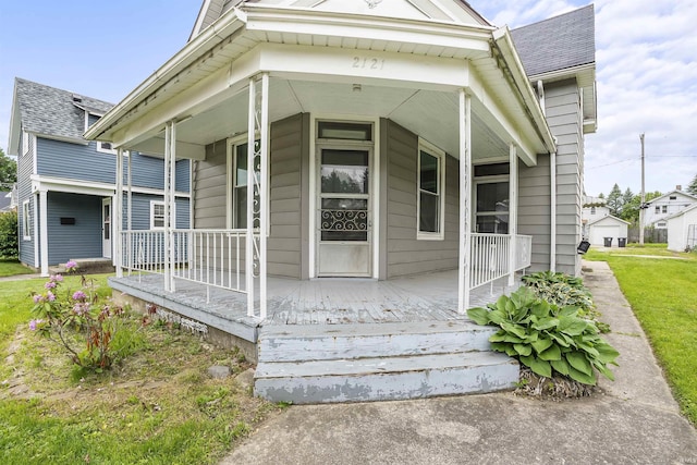 2121 Parnell Ave, Fort Wayne, IN 46805 - view of exterior entry with a porch and roof with shingles