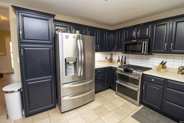 917 E Mill Creek Rd, Greensburg, IN 47240 - kitchen featuring stainless steel appliances, tasteful backsplash, and light countertops