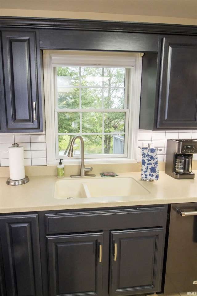 917 E Mill Creek Rd, Greensburg, IN 47240 - kitchen with a sink, light countertops, dishwasher, and backsplash