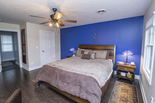 917 E Mill Creek Rd, Greensburg, IN 47240 - bedroom featuring baseboards, dark wood finished floors, and ceiling fan