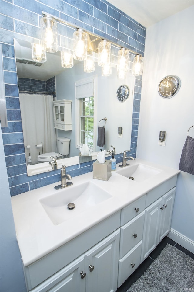 917 E Mill Creek Rd, Greensburg, IN 47240 - full bath with double vanity, toilet, a shower with curtain, and tile patterned flooring