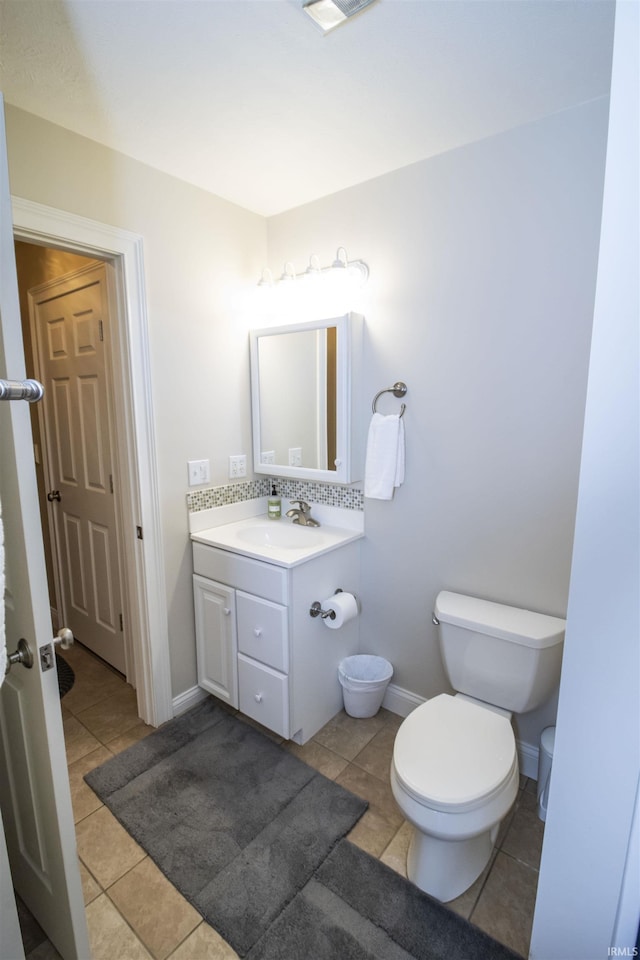 917 E Mill Creek Rd, Greensburg, IN 47240 - bathroom with vanity, toilet, tile patterned floors, and baseboards