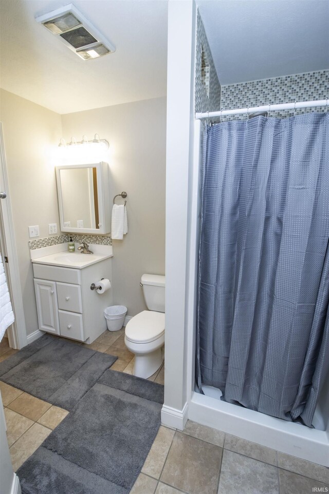 917 E Mill Creek Rd, Greensburg, IN 47240 - full bath with toilet, vanity, a stall shower, and tile patterned floors